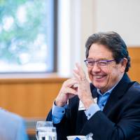 Jim Brooks talking with guests.